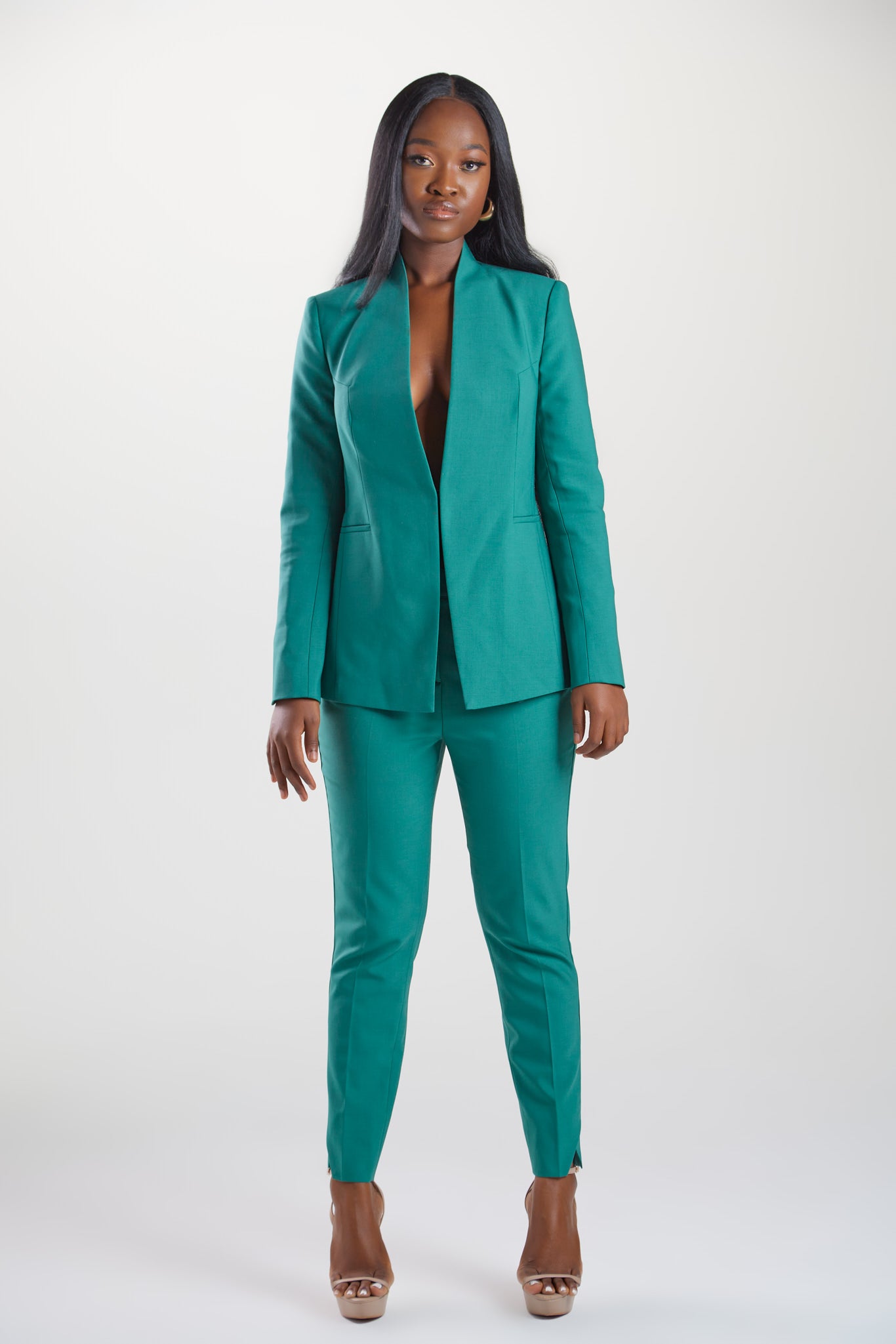 Seragyi's Nicole Blazer in Women's Suits, made from Italian Merino Wool. Features a cross-over collar and pyramid-cut sleeves, blending elegance and comfort in Women's Clothing.