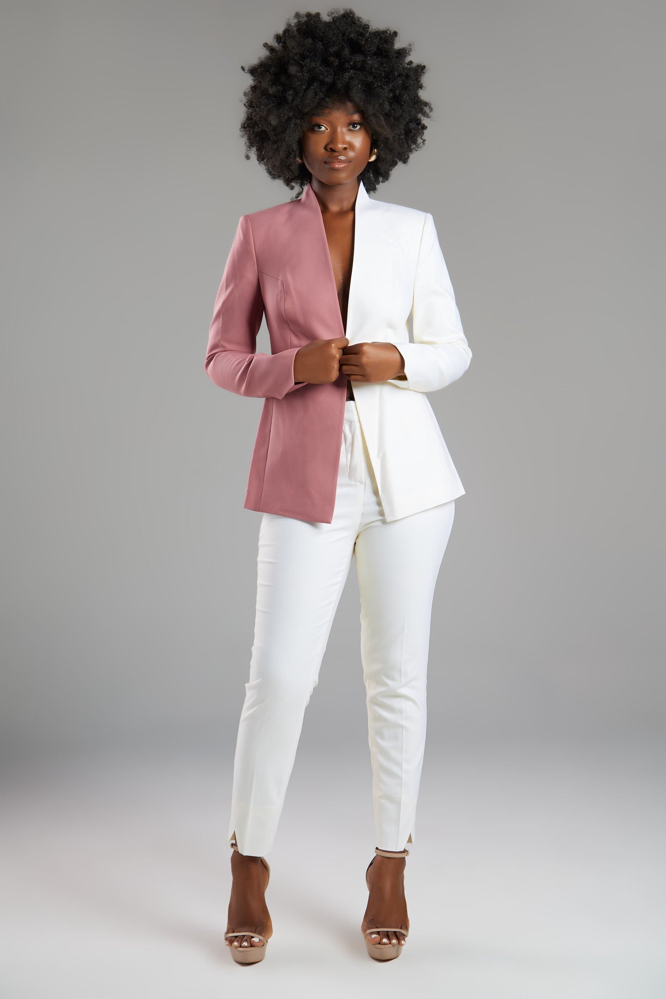 Seragyi's Nicole Blazer in Women's Suits, made from Italian Merino Wool. Features a cross-over collar and pyramid-cut sleeves, blending elegance and comfort in Women's Clothing.