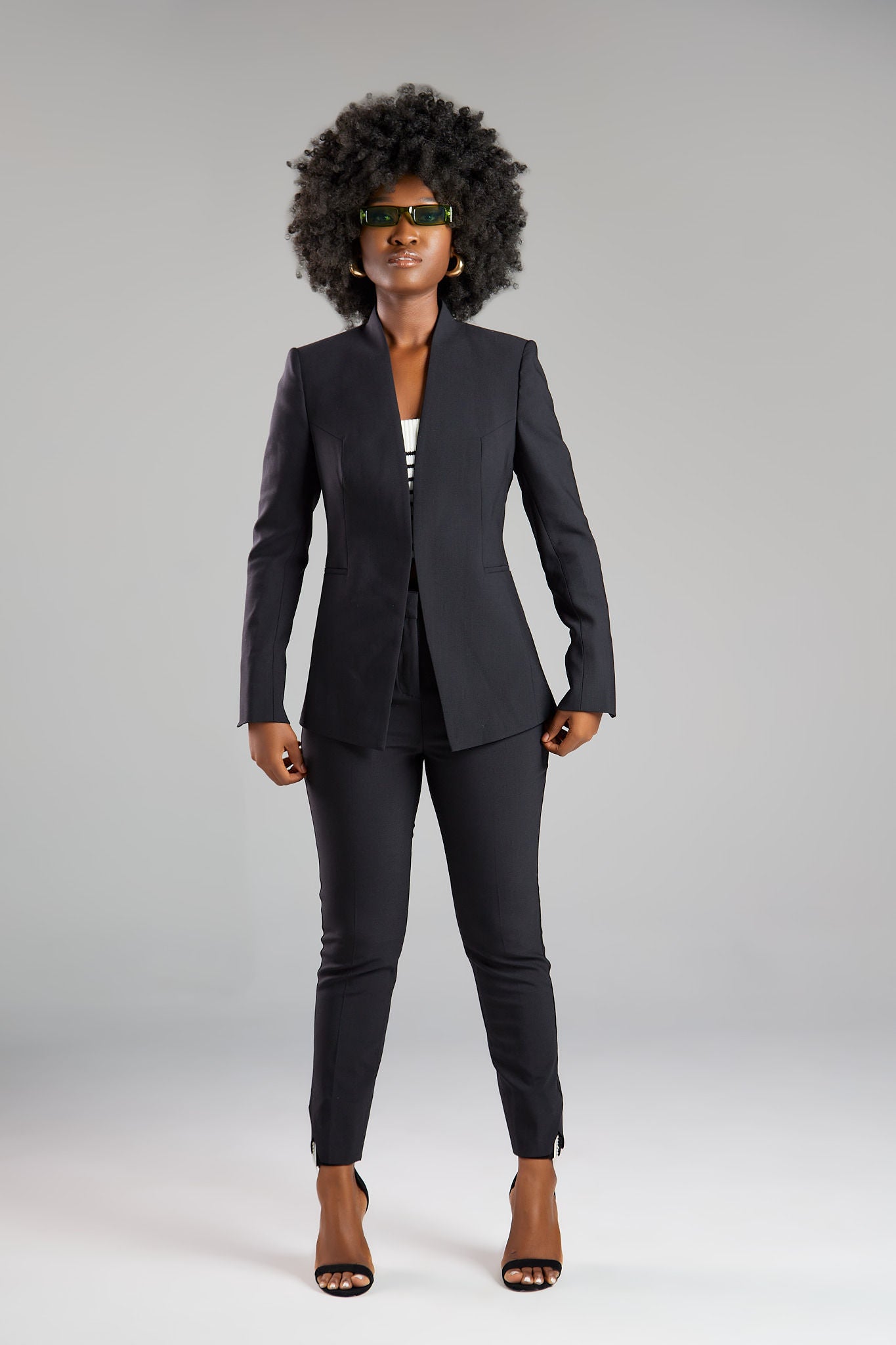 Seragyi's Nicole Blazer in Women's Suits, made from Italian Merino Wool. Features a cross-over collar and pyramid-cut sleeves, blending elegance and comfort in Women's Clothing.